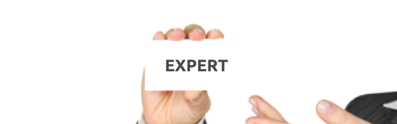 Certified language expert - image of a professional women holding a card reading EXPERT